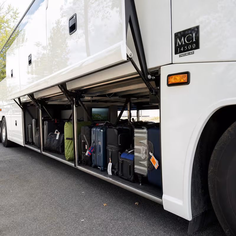 Party bus interior with wraparound leather seating and LED lighting in Fullerton