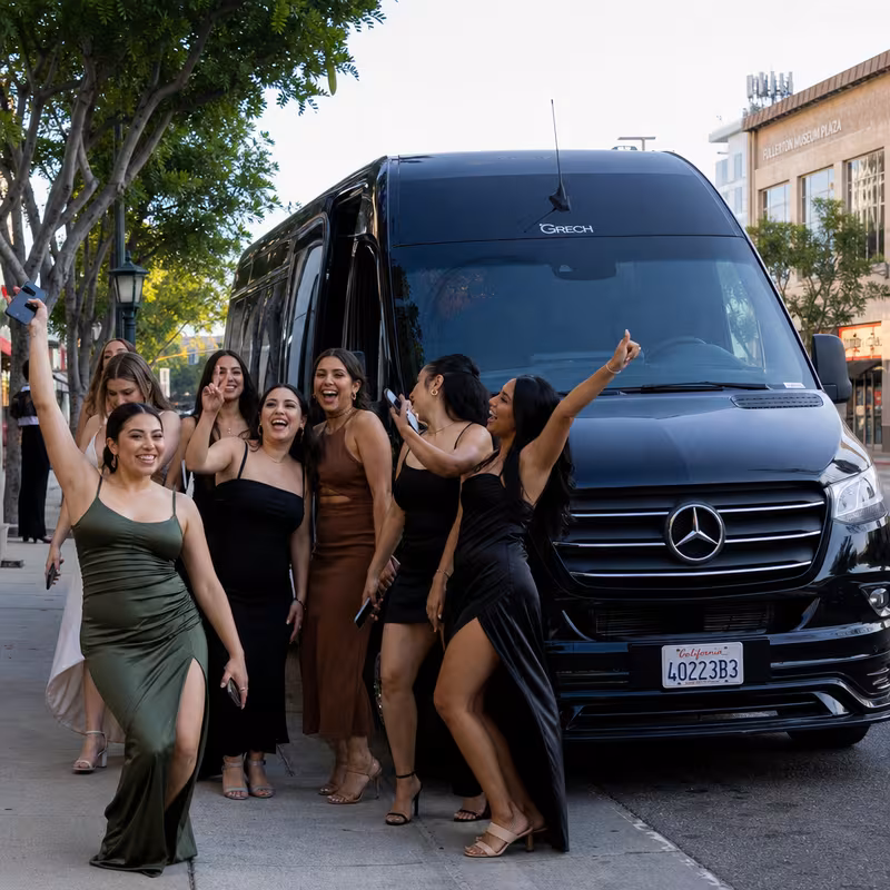Group boarding a white charter bus for Bachelor & Bachelorette Transportation transportation in Fullerton
