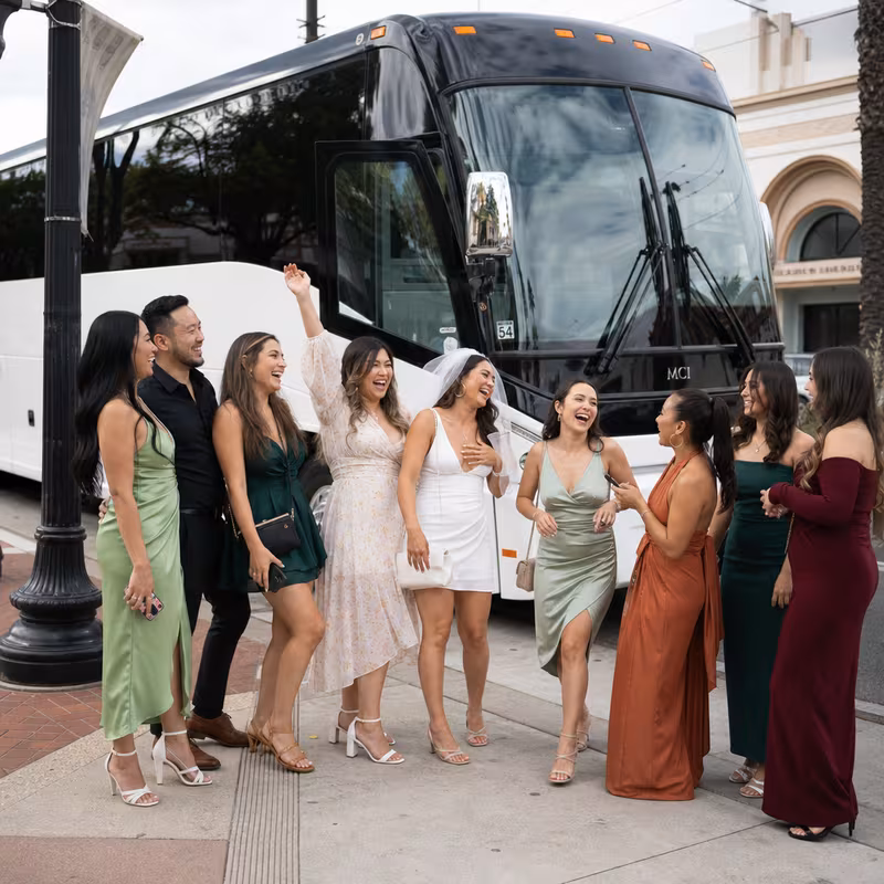 Passengers loading luggage while boarding an Fullerton group shuttle