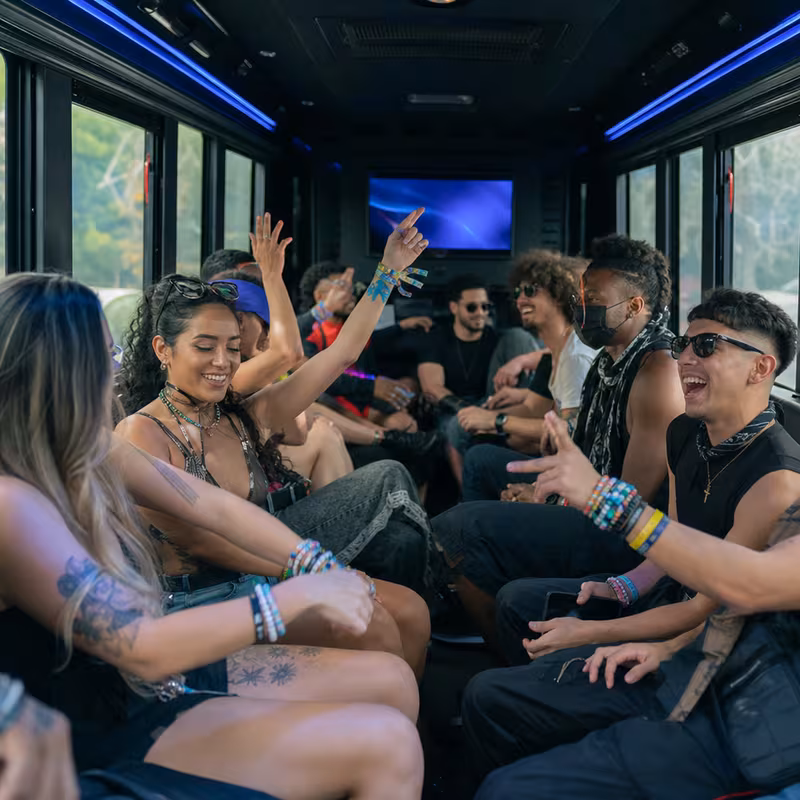 Passengers loading luggage while boarding an Fullerton group shuttle