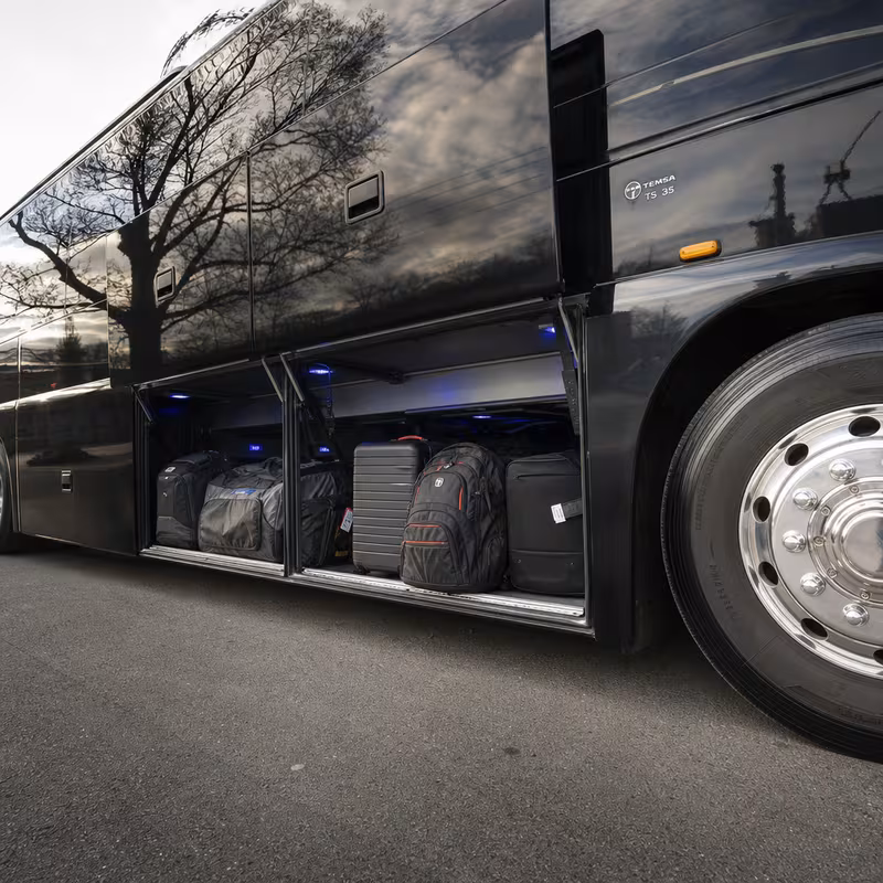 Party bus interior with wraparound leather seating and LED lighting in Fullerton