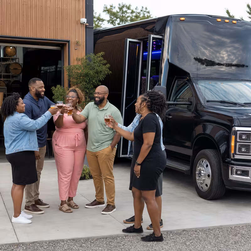 Passengers loading luggage while boarding an Fullerton group shuttle